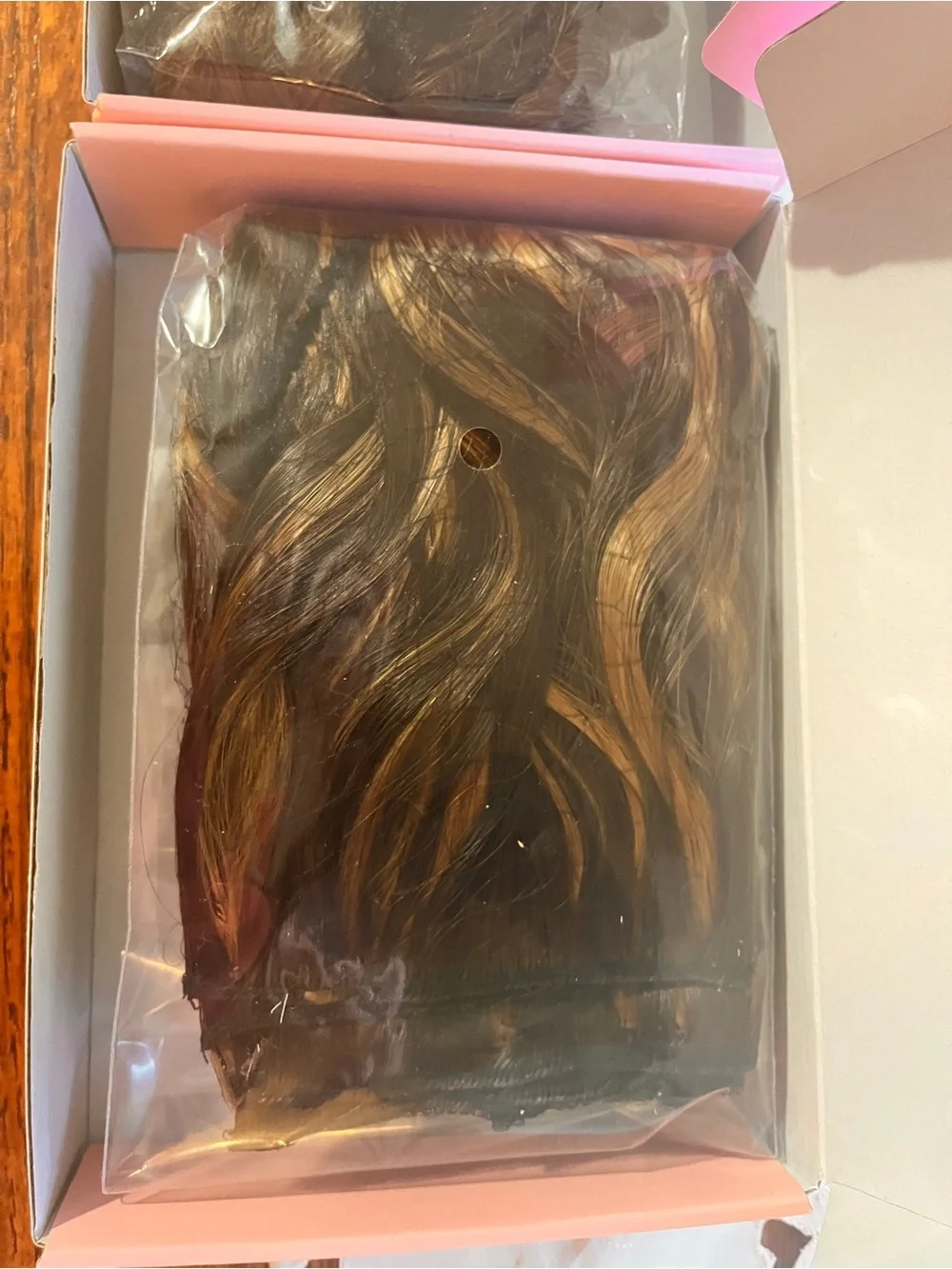 Hair Extensions (2) Honey Blonde Highlights and one that is Chocolate Brown